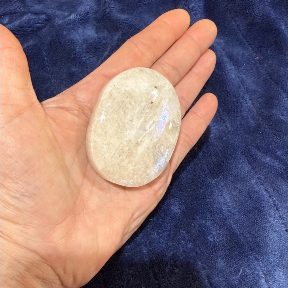 Clear selenite palm stone crystal